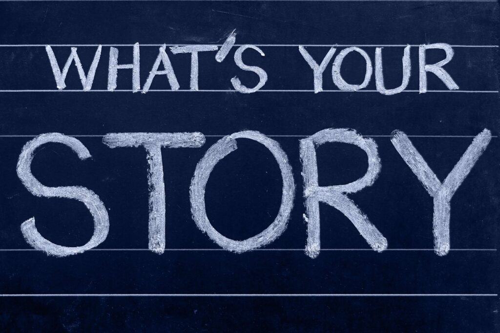 The words “What’s Your Story?” written on a chalkboard
