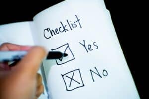 A person checking off boxes on a checklist